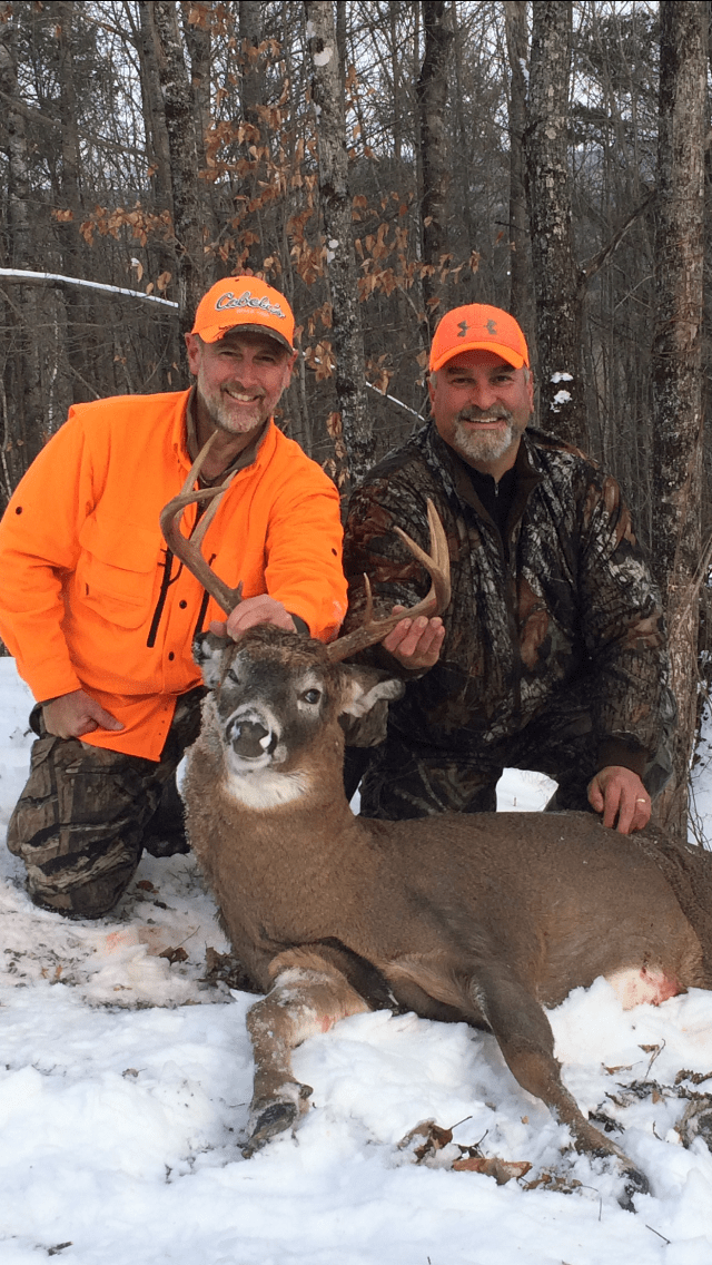 Two Men with White Tail Deer