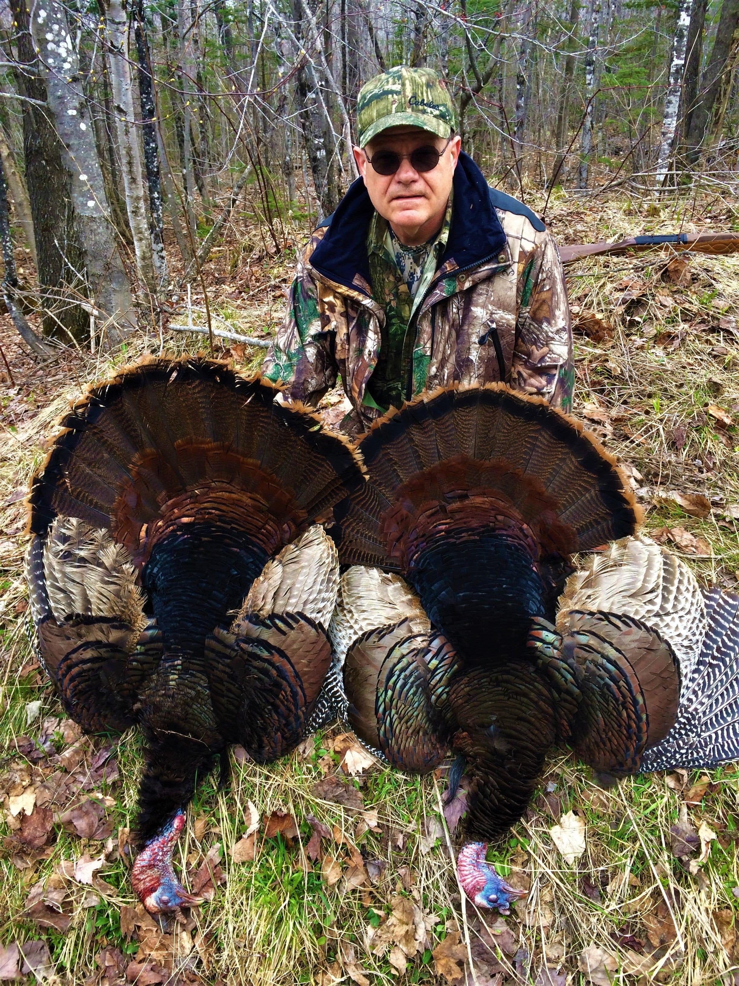 Man with Hunted Down Wild Turkeys