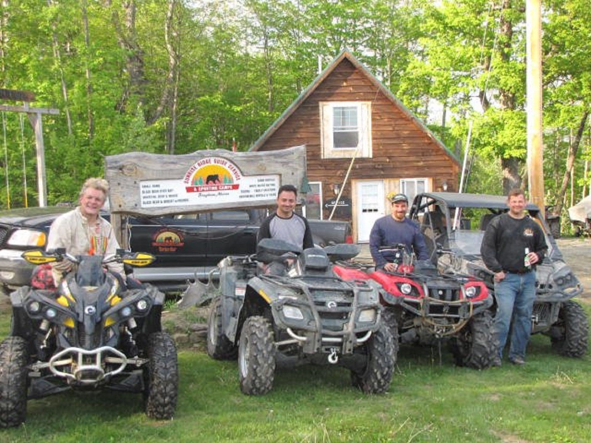 Group of People Standing Infront of Cabin