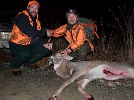 Two Men with Hunted Down White Tail Deer